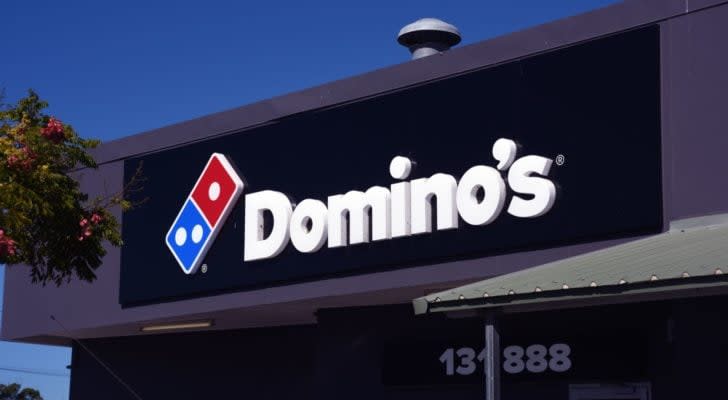 Domino's (DPZ) sign on a building at night