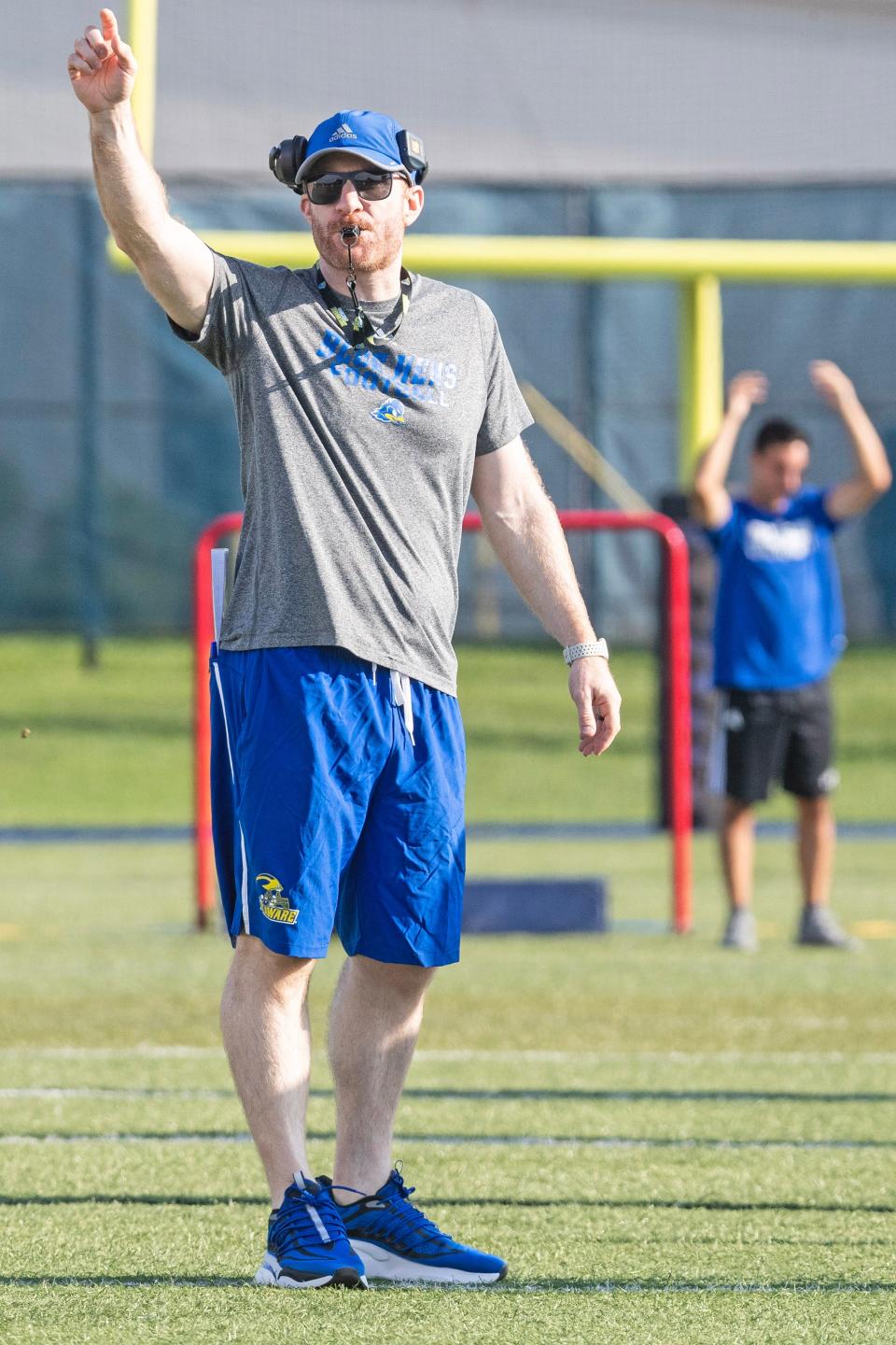 Delaware Blue Hens head coach Ryan Carty provides instruction during the first preseason football practice at the Delaware football practice field in Newark, Monday, July 31, 2023.