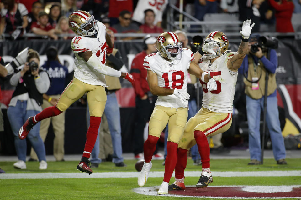 San Francisco 49ers wide receiver Dante Pettis (18) celebrates his touchdown against the Arizona Cardinals with wide receiver Emmanuel Sanders (17) and tight end George Kittle (85) during the second half of an NFL football game, Thursday, Oct. 31, 2019, in Glendale, Ariz. (AP Photo/Rick Scuteri)