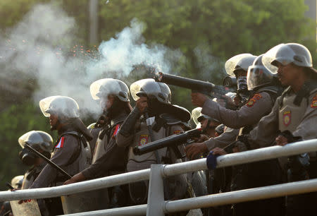 Police fire tear gas to disperse protesters in Jakarta, Indonesia May 22, 2019 in this photo taken by Antara Foto. Antara Foto/Indrianto Eko Suwarso/ via REUTERS ATTENTION EDITORS - THIS IMAGE WAS PROVIDED BY A THIRD PARTY. MANDATORY CREDIT. INDONESIA OUT. NO COMMERCIAL OR EDITORIAL SALES IN INDONESIA.
