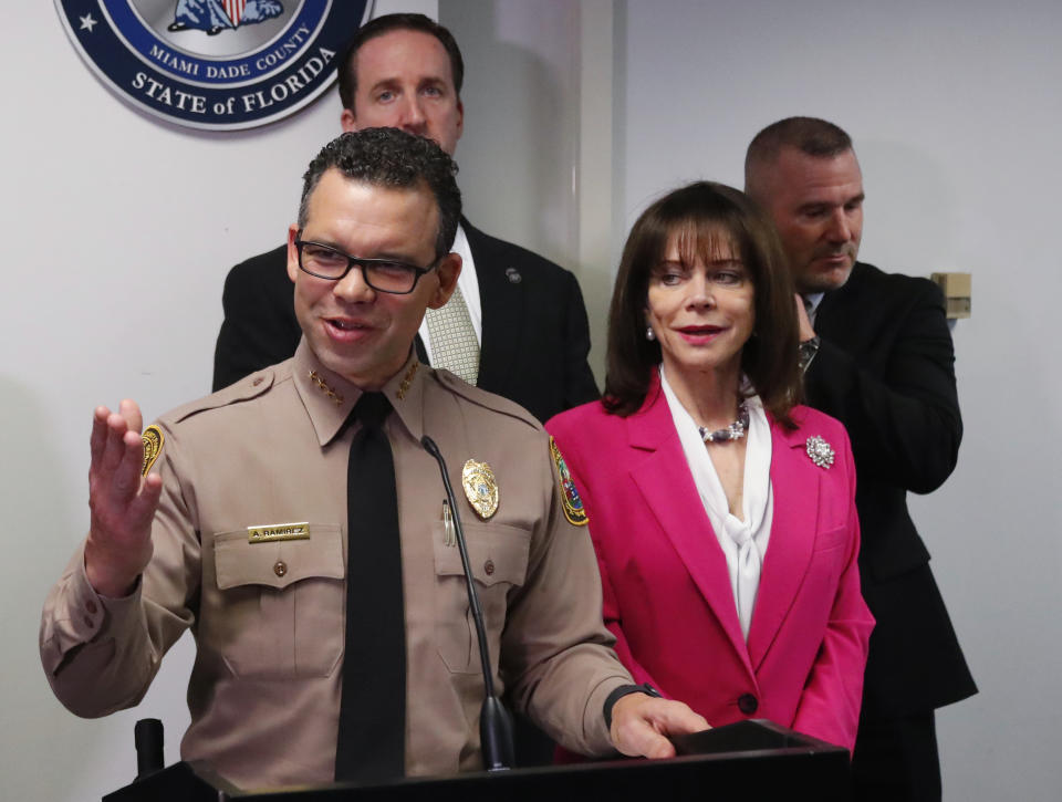 Alfredo Ramirez, foreground, director of the Miami-Dade Police Department, speaks during a news conference on the arrest of the "pillowcase rapist" responsible for numerous sexual assaults of women in the Miami area during the 1980s, Thursday, Jan. 23, 2020, in Miami. Robert Koehler, 60, was arrested over the weekend in Brevard County and was being held without bond Thursday after his transfer to a Miami jail. At right foreground is Miami-Dade State Attorney Katherine Fernandez Rundle. (AP Photo/Wilfredo Lee)