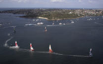 United States SailGP Team, right, helmed by Rome Kirby leads the field during a race of the Sydney SailGP, on Sydney Harbour, Friday, Feb. 28, 2020. (David Gray/SailGP via AP)