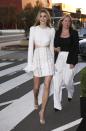 <p>Victoria put on a leggy display in a white cut-out dress with frill sleeves. So chic.</p>