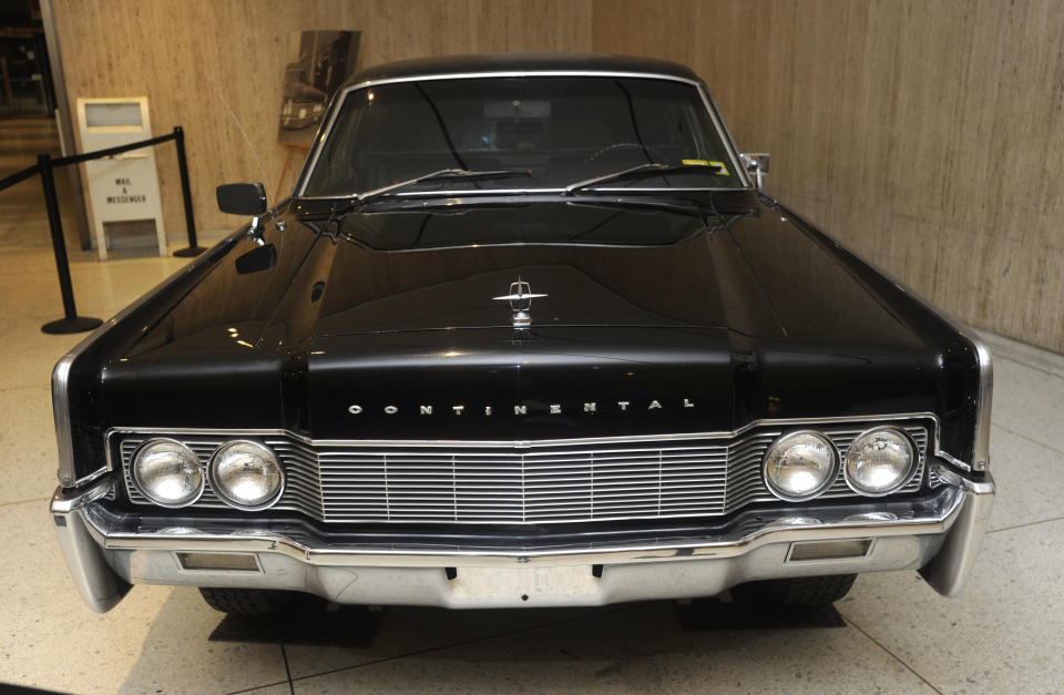 In this July 31, 2012 photo, a stretched Lincoln Continental used by Gov. Nelson Rockefeller sits on display on the concourse of the Empire State Plaza in Albany, N.Y. Historic artifacts that have been kept in storage for years are now on display in the corridors of the Capitol and the adjacent Empire State Plaza. (AP Photo/Tim Roske)