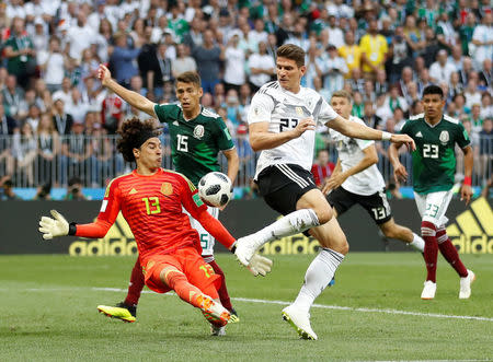 Soccer Football - World Cup - Group F - Germany vs Mexico - Luzhniki Stadium, Moscow, Russia - June 17, 2018 Germany's Mario Gomez shoots at goal as Mexico's Guillermo Ochoa challenges REUTERS/Carl Recine