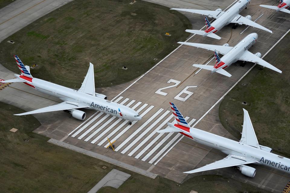 FILE PHOTO: American Airlines passenger planes crowd a runway where they are parked due to flight reductions made to slow the spread of coronavirus disease (COVID-19), at Tulsa International Airport in Tulsa, Oklahoma, U.S. March 23, 2020. REUTERS/Nick Oxford