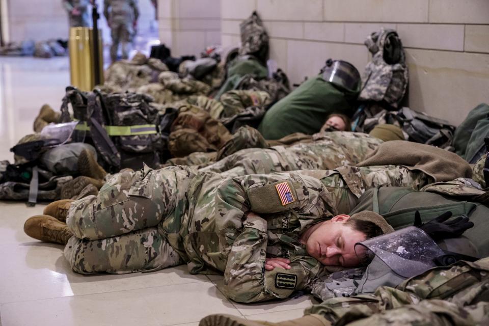 Hundreds of National Guard troops hold inside the Capitol Visitor's Center to reinforce security at the Capitol in Washington, on Wednesday.