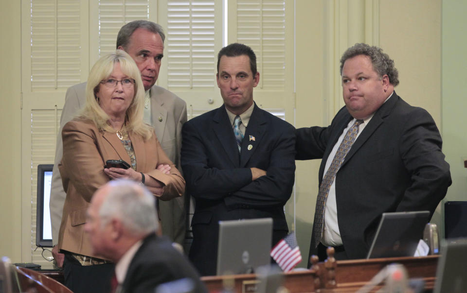 Assembly Minority Leader Connie Conway, of Tulare, left, and GOP Assembly members Mike Morrell, of Rancho Cucamonga, second from left, Steve Knight, of Lancaster, third from left, and Jeff Miller of Corona, listen to the debate over measure to close a corporate tax loophole and use the money for college scholarships, at the Capitol in Sacramento, Calif., Monday, Aug. 13, 2012. Despite Republican opposition, the measure, AB1500, which would eliminate a $1 billion tax break for out-of-state corporations and use the money for college scholarships for families earning between $80,000-$100,000, was approved 54-25 and sent to the Senate. (AP Photo/Rich Pedroncelli)