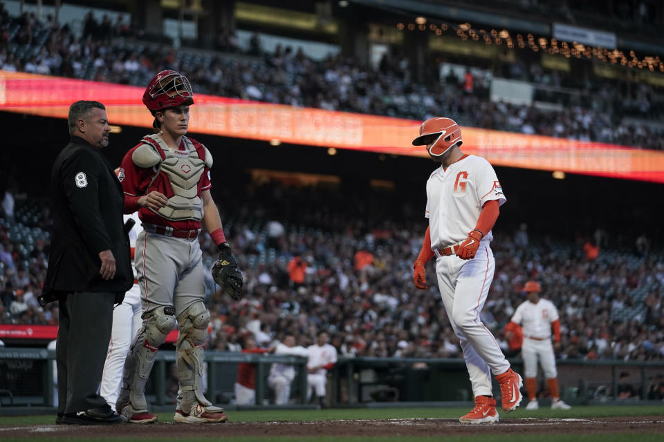San Francisco Giants' Patrick Bailey, right, scores on a balk by Cincinnati Reds pitcher Brandon Williamson during the second inning of a baseball game Tuesday, Aug. 29, 2023, in San Francisco. (AP Photo/Godofredo A. Vásquez)