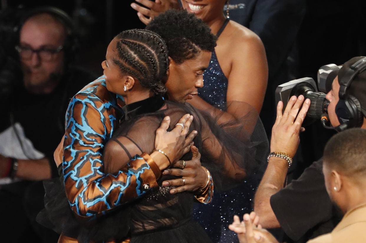 50th NAACP Image Awards - Show - Los Angeles, California, U.S., March 30, 2019 - Letitia Wright is embraced by Chadwick Boseman after after winning for outstanding breakthrough performance in a motion picture for her role in "Black Panther." REUTERS/Mario Anzuoni