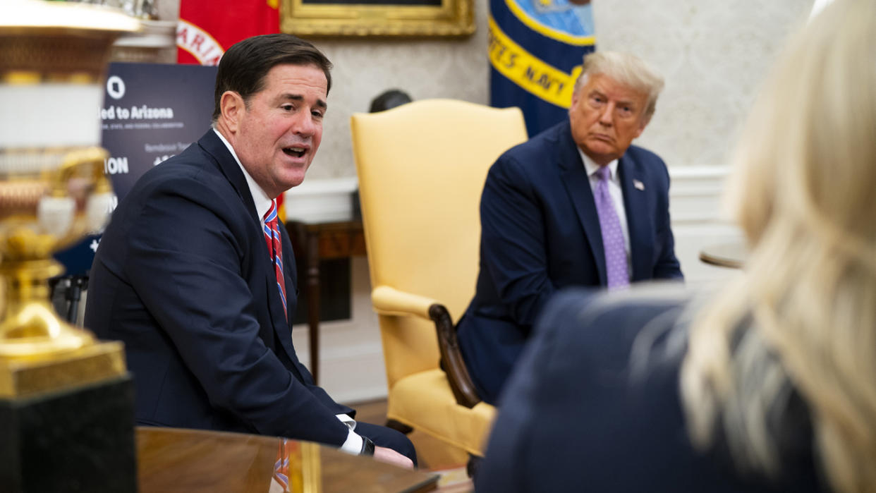 Arizona Gov. Doug Ducey meets President Donald Trump in the White House in August last year.  
