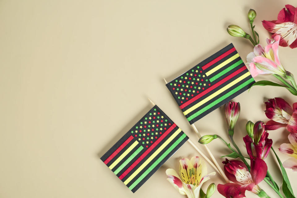 US flags colored in juneteenth/African colors