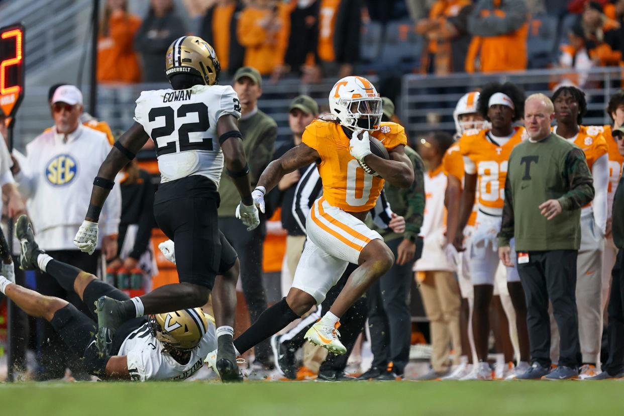 Nov 25, 2023; Knoxville, Tennessee, USA; Tennessee Volunteers running back Jaylen Wright (0) runs the ball against the Vanderbilt Commodores during the first half at Neyland Stadium. Mandatory Credit: Randy Sartin-USA TODAY Sports