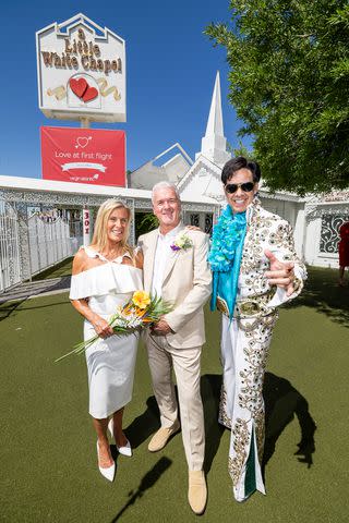 <p>Virgin Atlantic Airways</p> Malcolm and Jacqui posing with the Elvis impersonator outside of the famous Little White Chapel