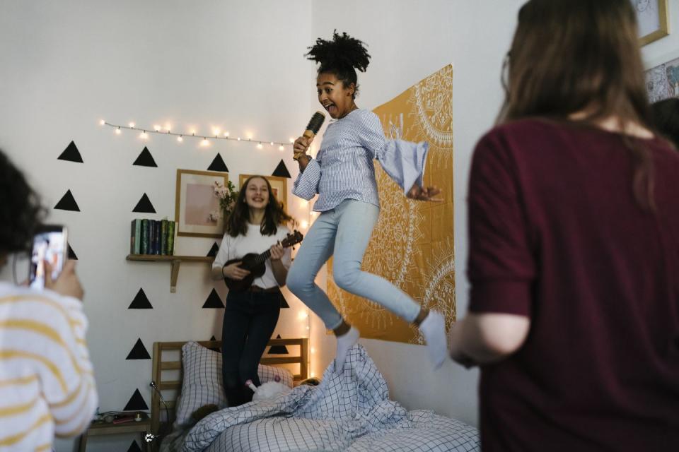 black tween jumping in the air