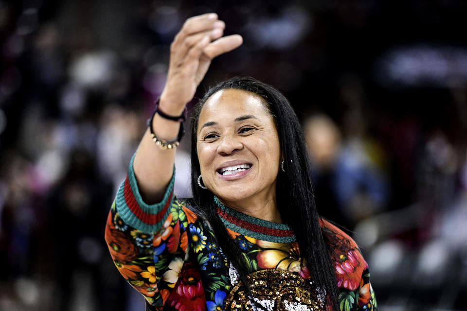 FILE- In this Dec. 15, 2019, file photo, South Carolina head coach Dawn Staley participates in the school anthem after an NCAA college basketball game against Purdue in Columbia, S.C. The veteran Gamecocks coach was announced as The Associated Press women's basketball coach of the year Monday, March 23, 2020. (AP Photo/Sean Rayford, File)