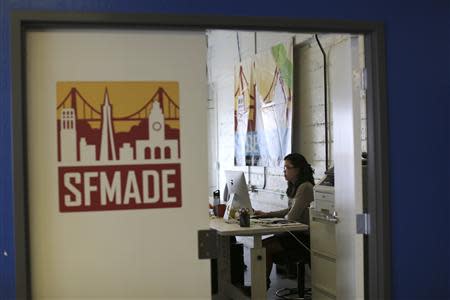 A woman works in a studio at TechShop in the South of Market neighborhood in San Francisco, California April 24, 2014. REUTERS/Robert Galbraith