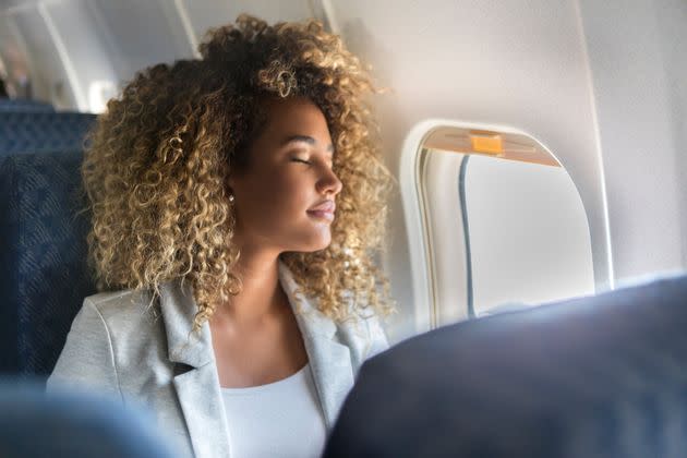 Should you be applying sunscreen before flights? Here's what experts say.