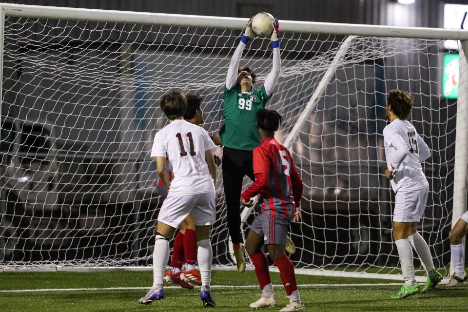 Veterans Memorial's Aeden Luna saves a goal attempt by Flour Bluff at Cabaniss Soccer Field on Friday, Feb. 17, 2023, in Corpus Christi, Texas.