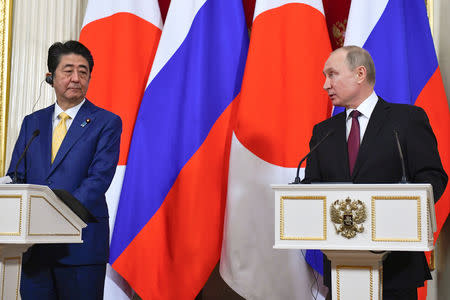 Russian President Vladimir Putin (R) and Japanese Prime Minister Shinzo Abe make a joint statement following their meeting at the Kremlin in Moscow, Russia January 22, 2019. Alexander Nemenov/Pool via REUTERS