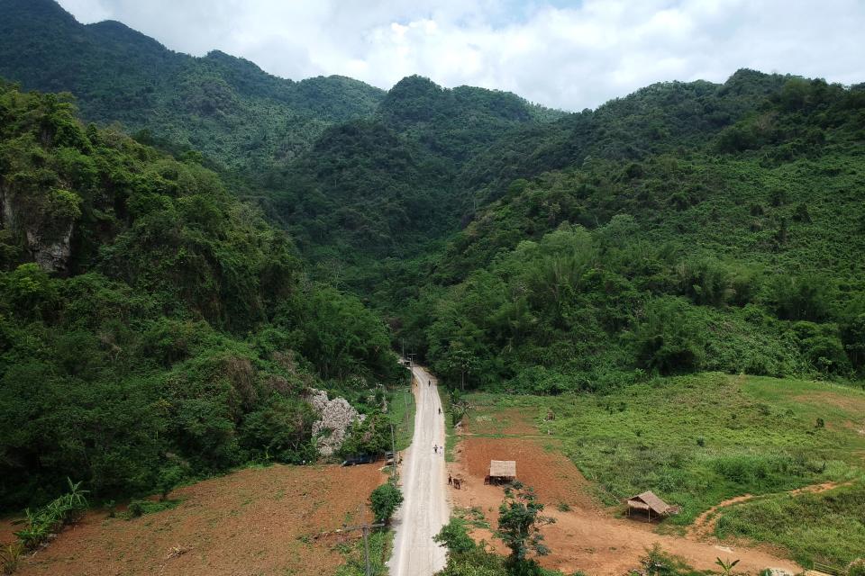 This aerial picture taken on June 15, 2019 shows the road leading to the Tham Luang cave, in which 12 boys from the 