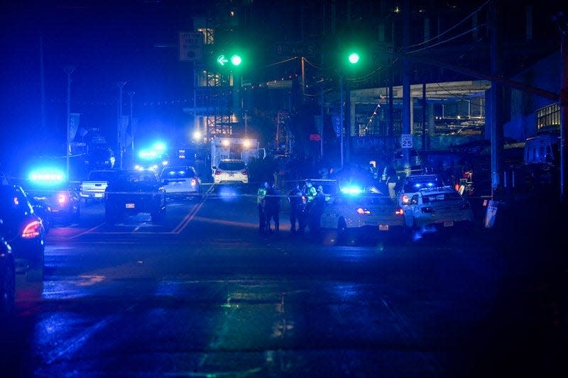 A large police presence blocked traffic on Division Street and 8th Avenue on Thursday, June 2, 2022, after a liquor store security guard was fatally shot.