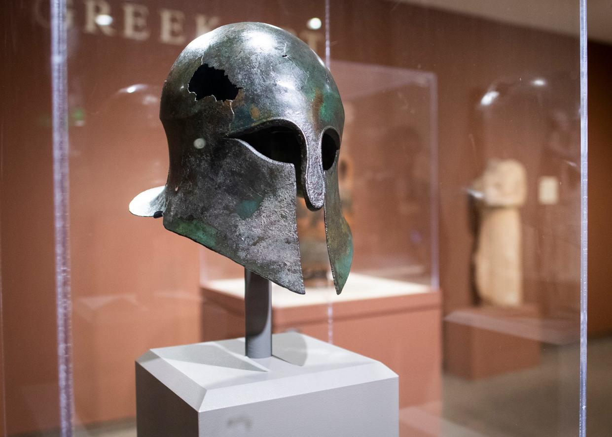 A Corinthian helmet, cira 550-450 BCE, a piece from the Higgins Armory Collection, on display at the Worcester Art Museum in 2018.