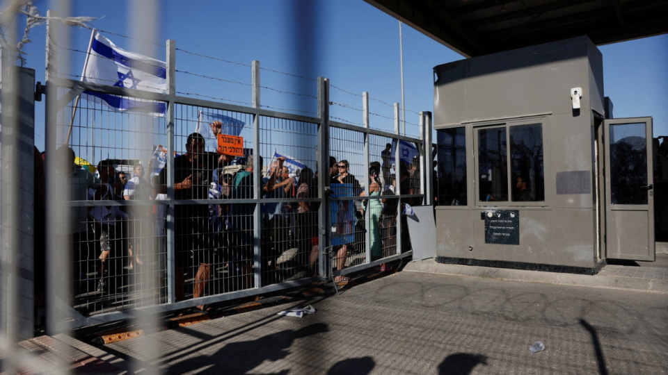 Protesters gather outside the Sde Teiman detention center after some of them broke in, after Israeli military police arrived at the scene as part of an investigation into the suspected abuse of a Palestinian detainee, near Beersheba