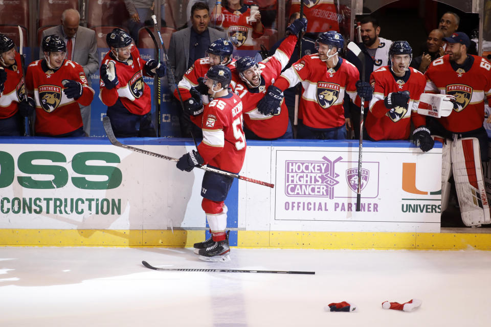 Florida Panthers' Noel Acciari (55) celebrates with teammates after scoring on a penalty shot for a hat trick during the second period of the team's NHL hockey game against the Dallas Stars, Friday, Dec. 20, 2019, in Sunrise, Fla. (AP Photo/Luis M. Alvarez)