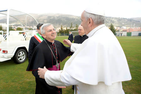 Pope Francis is welcomed by Archbishop Michele Castoro as he arrives in San Giovanni Rotondo, Italy March 17, 2018. Osservatore Romano/Handout via REUTERS