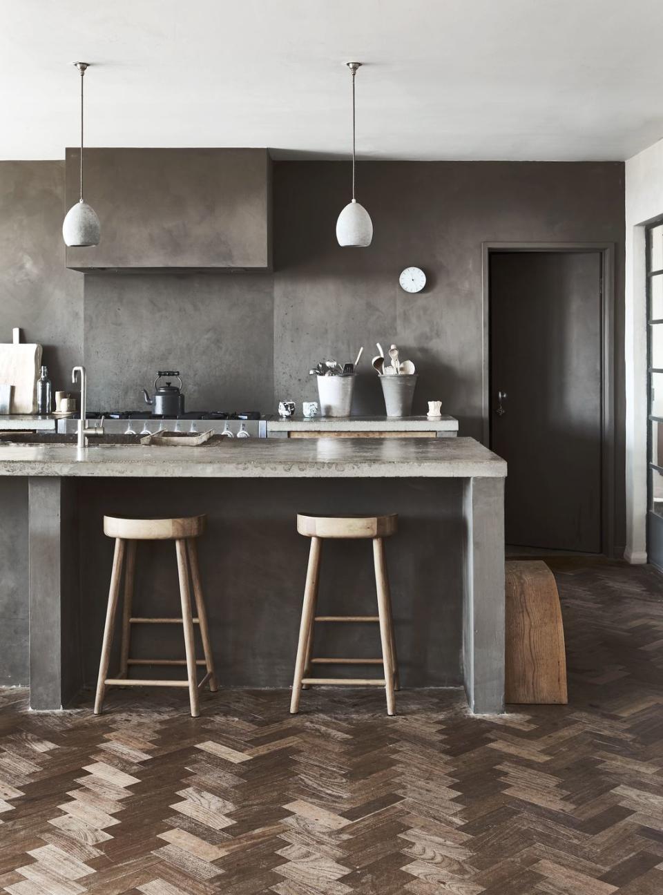 a kitchen with two bar stools