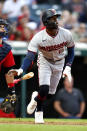 Minnesota Twins' Nick Gordon, right, watches his two-run home run against the Cleveland Guardians during the sixth inning of a baseball game Monday, June 27, 2022, in Cleveland. (AP Photo/Ron Schwane)