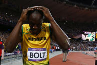 Jamaica's Usain Bolt reacts after winning the men's 100m final during the London 2012 Olympic Games at the Olympic Stadium August 5, 2012. Bolt set an Olympic record with a time of 9.63 seconds. REUTERS/Kai Pfaffenbach (BRITAIN - Tags: OLYMPICS SPORT ATHLETICS) 