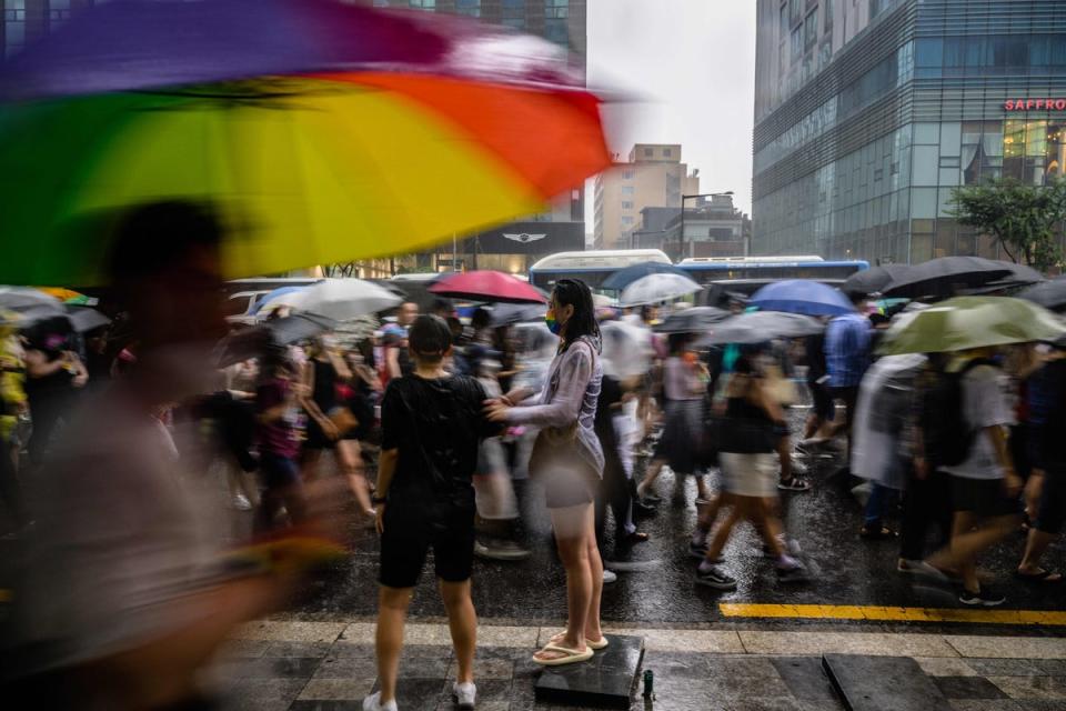 File: Participants take part in a parade as it rains heavily during a Pride event in support of LGBTQ rights as part of the Seoul Queer Culture Festival in Seoul  (AFP via Getty Images)