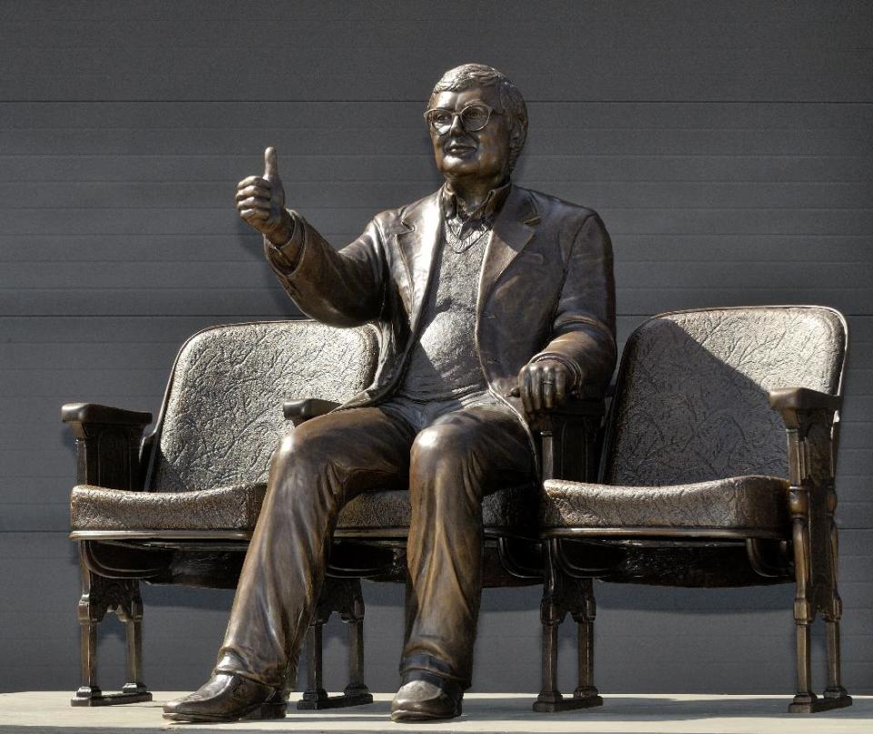 This April 22, 2013 photo provided by Thompson-McClellan shows a bronze statue of Pulitzer Prize winning film critic Roger Ebert giving his famous 'thumbs up" sign in Champaign, Ill. The statue will be unveiled Thursday, April 24, 2014, outside the Virginia Theatre in Champaign where Ebert held his annual film festival. Ebert died in April 2013. (AP Photo/Courtesy of Thomspon.McClellan)