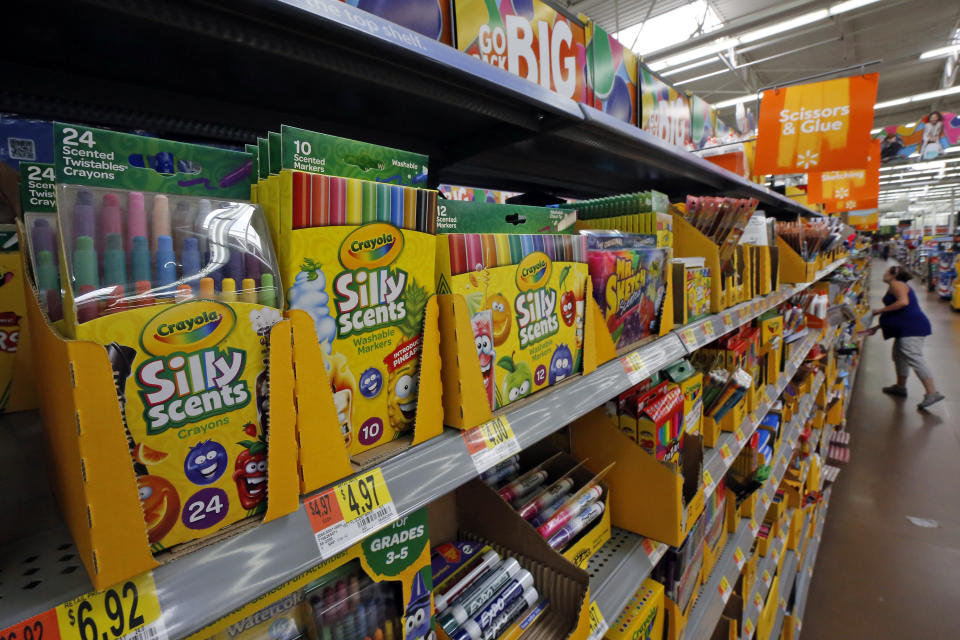 FILE- This July 19, 2018, file photo shows a display of scented markers and crayons in a Walmart in Pittsburgh. Environmentally friendly school supplies often carry big prices, but if you expand your idea of what counts as “green,” you’ll open other ways to save. (AP Photo/Gene J. Puskar, File)