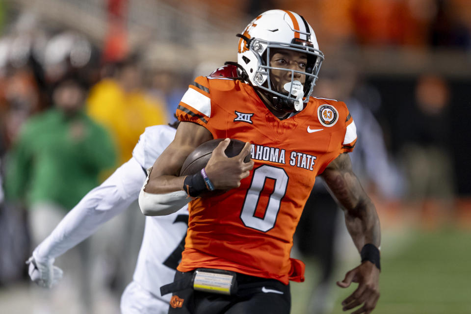 Oklahoma State running back Ollie Gordon II (0) runs for a touchdown during the second half of an NCAA college football game against Cincinnati Saturday, Oct. 28, 2023, in Stillwater, Okla. (AP Photo/Mitch Alcala)