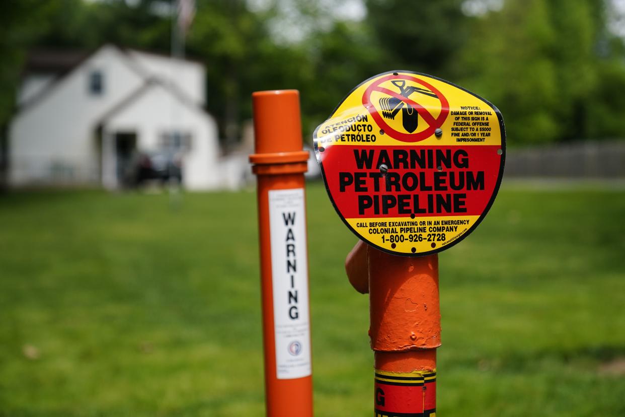 A warning sign is posted along the path of the Colonial Pipeline in Garnet Valley, Pa., Monday, May 10. 