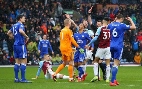 Harry Maguire of Leicester City is shown a red card by referee Michael Oliver during the Premier League match between Burnley FC and Leicester City at Turf Moor - Credit: Getty images