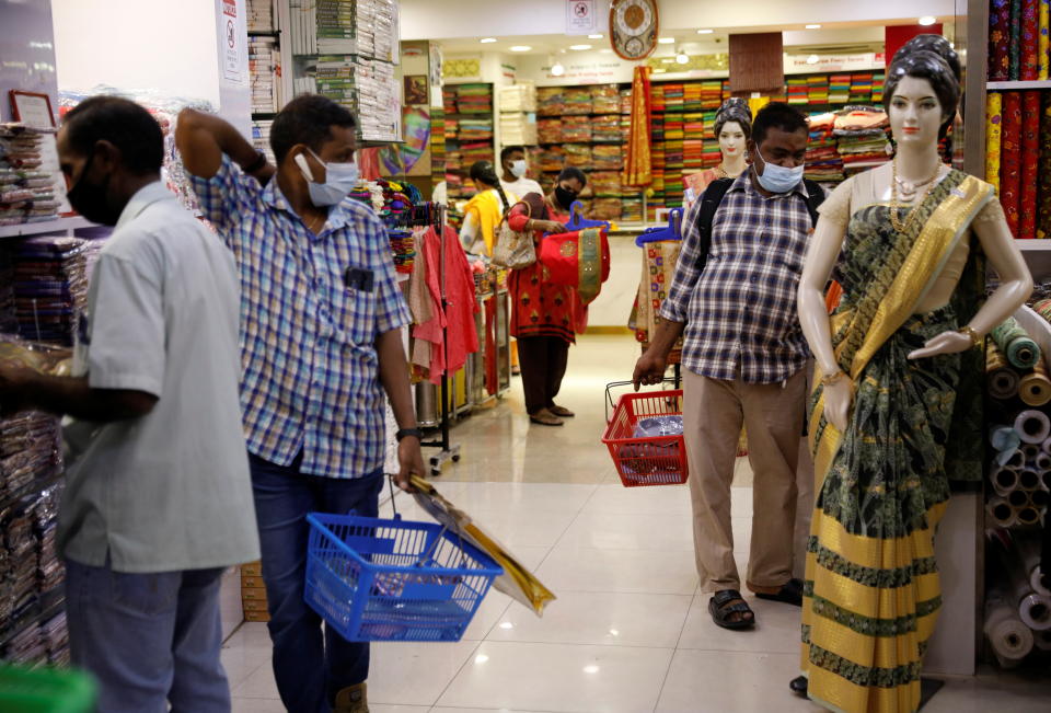 Migrant workers shopping at Little India amid a pilot programme to allow fully-vaccinated migrant workers back to the community in Singapore.