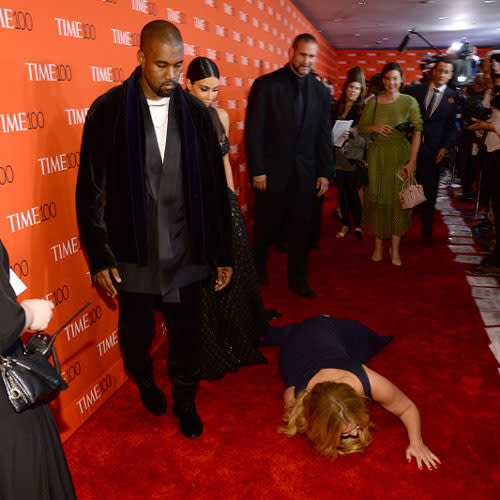 <em>Amy Schumer</em> made sure to show Kanye West and Kim Kardashian the reverence they enjoy receiving when she got down on her hands and knees to worship them on the red carpet at the 2015 <em>TIME </em>100 gala in New York City on Tuesday. The actress and comedian -- who recently did a hilarious job hosting the MTV Movie Awards -- dropped to the floor and bowed down at the power couple's feet in one of the funniest and most uncomfortable displays of adoration ever. <strong>VIDEO: The 6 Most Outrageously Inappropriate Moments at the MTV Movie Awards </strong> While Amy prostrated himself at the altar of Kimye, the 37-year-old rapper -- who was set to perform at the star-studded event -- didn't look like he was in the mood for her shenanigans. Or maybe that's just how he always looks on red carpets, it's hard to tell. Getty Images Kim, meanwhile, looked to be politely entertained by Amy's antics, which were caught at every angle by the throng of press photographers. Getty Images Amy's popular Comedy Central sketch show <em>Inside Amy Schumer</em> returns Tuesday for its fourth season. It's unclear if Amy's prank was possibly a publicity stunt, or just an attempt to make the couple as wildly uncomfortable as possible. Either way, it seemed to work. <strong>VIDEO: Kanye West Insists He's Not Part of the Illuminati </strong> Later in the evening, Amy tweeted a photo of her glorious moment, and thanked Time for the opportunity to get a little crazy. Thanks #TIME100 pic.twitter.com/bdAjImc5J5— Amy Schumer (@amyschumer) April 22, 2015 Aside from her sketch show, Amy is also starring in the upcoming comedy <em>Trainwreck</em>, opposite Bill Hader. Check out the trailer for the highly anticipated comedy below.