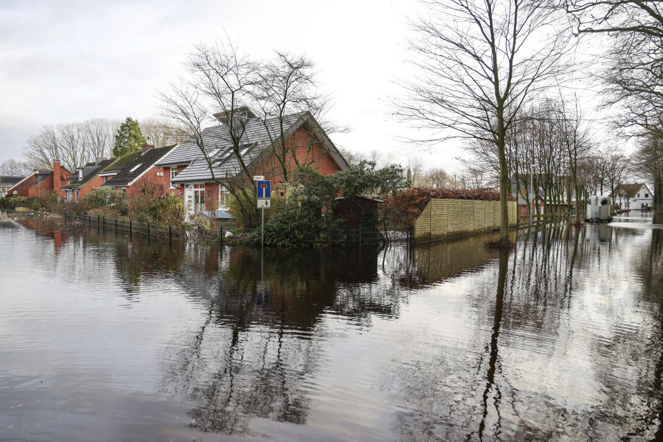 Roads and residential buildings are flooded in the area of the river Woerpe in Lilienthal, Germany, Thursday, Dec. 28, 2023. Parts of northern Germany are continuing to grapple with flooding as rivers remain swollen after heavy rain. (Focke Strangmann/dpa via AP)