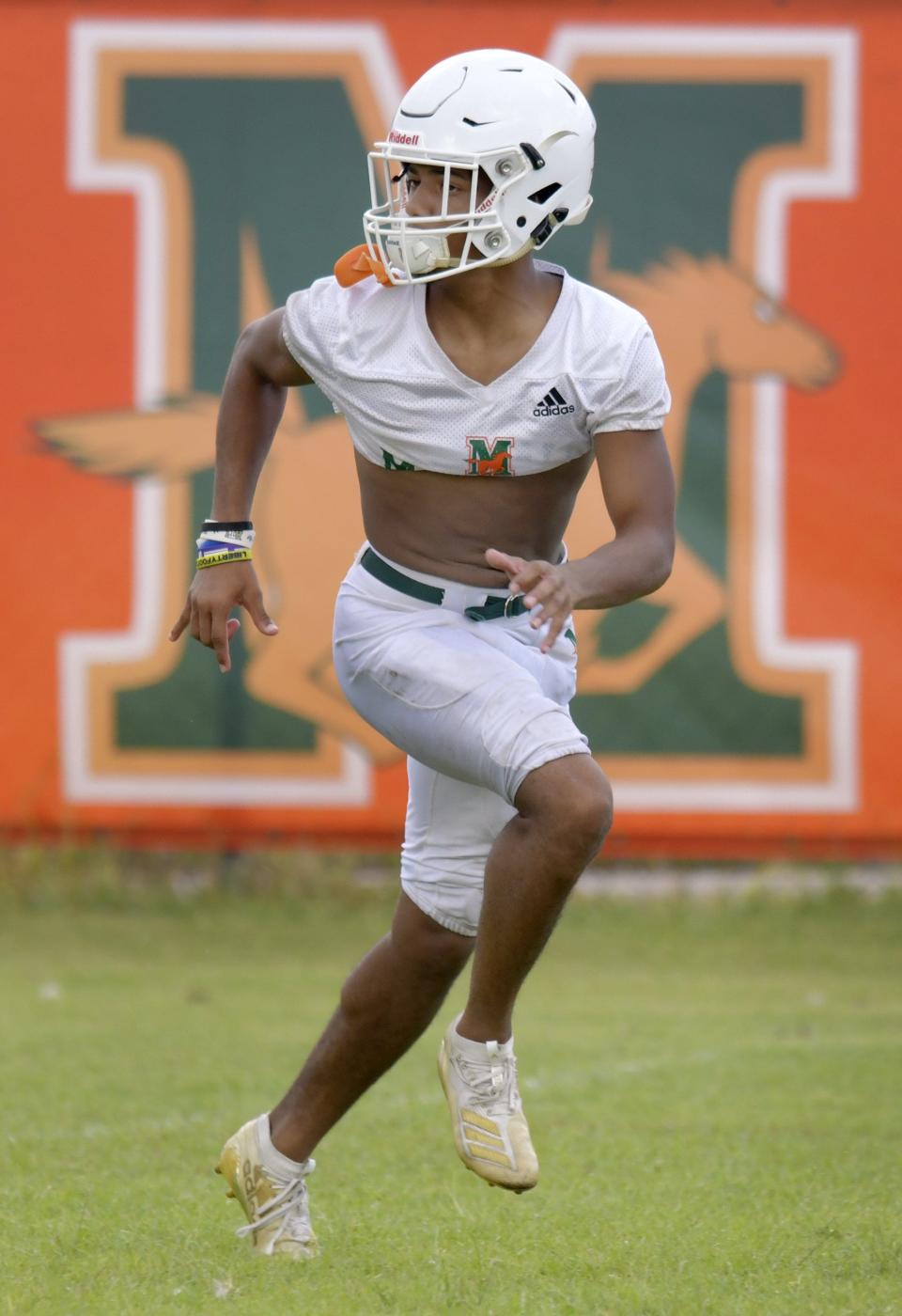 Wide receiver Jaime Ffrench runs a pass pattern during drills during the Mandarin High School Mustangs football practice at the school's practice field Wednesday, August 17, 2022. [Bob Self/Florida Times-Union]