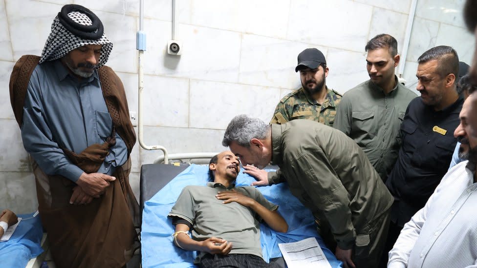 PMF chief of staff (C-R) visits a man wounded in the explosion at a hospital