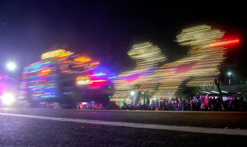 The Lodi Police float winds its way through downtown Lodi in the annual Kiwanis Lodi Parade of Lights on Dec. 2. A slow shutter speeds blurs the motion of the lights on the float.