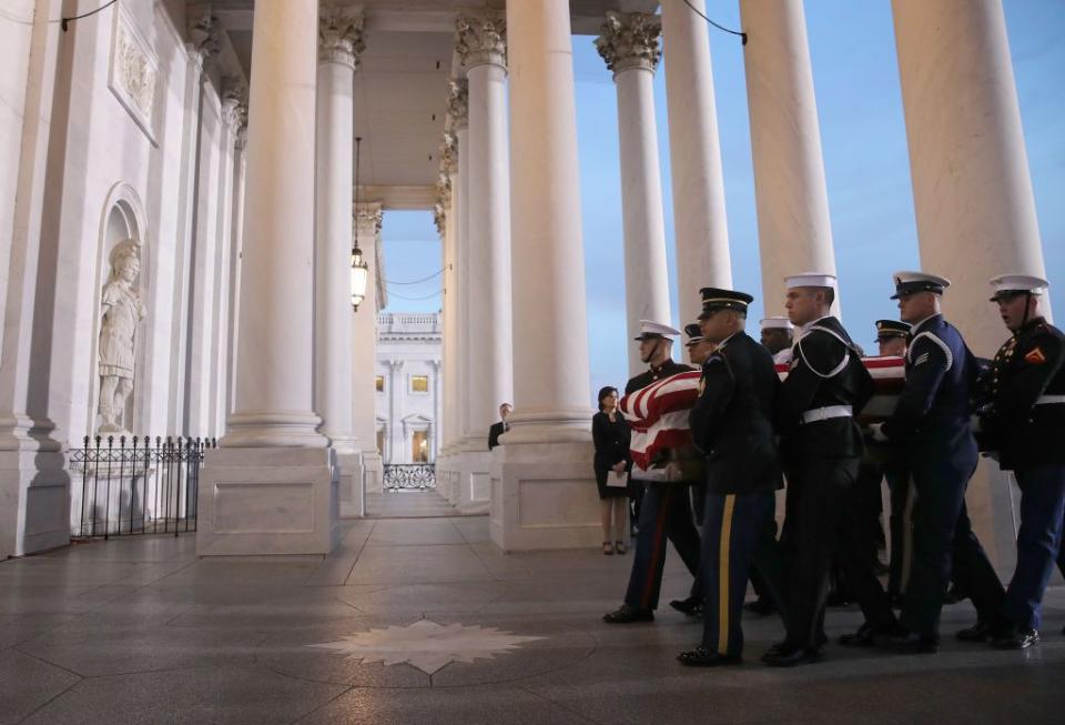 9) The military honor guard nears the entrance of the U.S. Capitol.