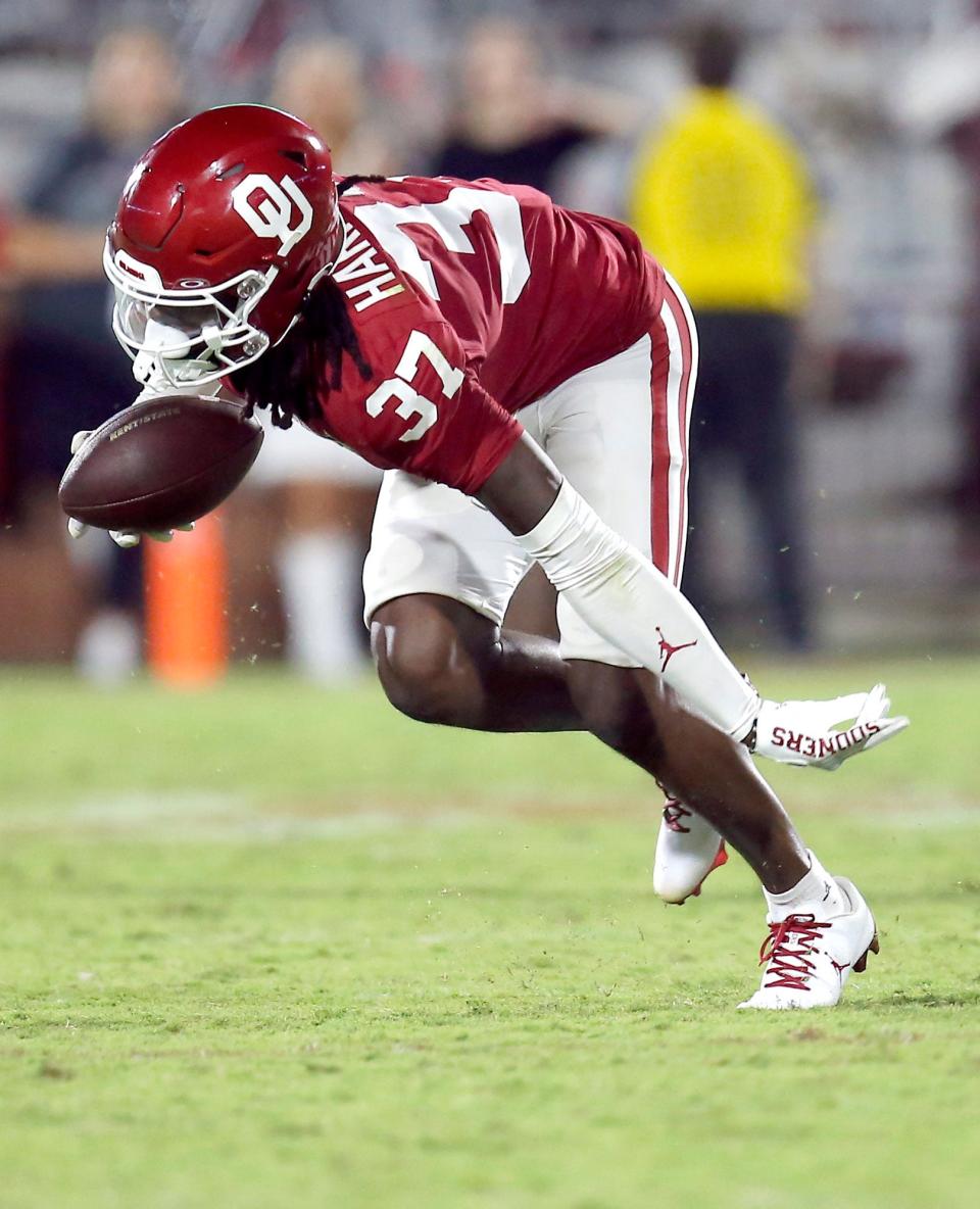 OU's Justin Harrington (37) intercepts a pass in the fourth quarter against Kent State last season in Norman.