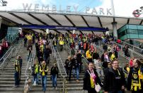 Fans make their way from Wembley Park Station near Wembley Stadium before the game.