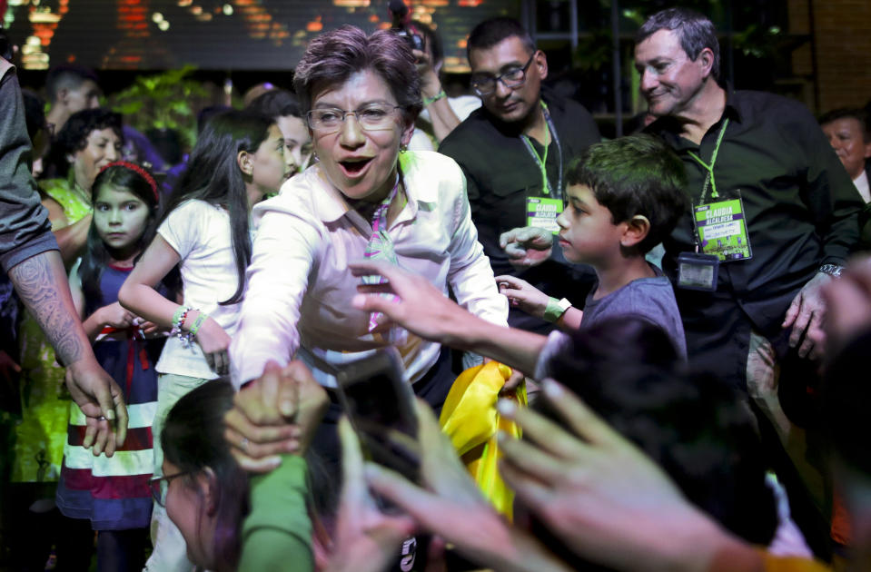 Claudia Lopez, candidate for mayor of Bogota with the Green Alliance, celebrates her election victory in Bogota, Colombia, Sunday, Oct. 27, 2019. Colombians went to the polls Sunday to choose mayors, state governors and local assemblies. (AP Photo/Ivan Valencia)