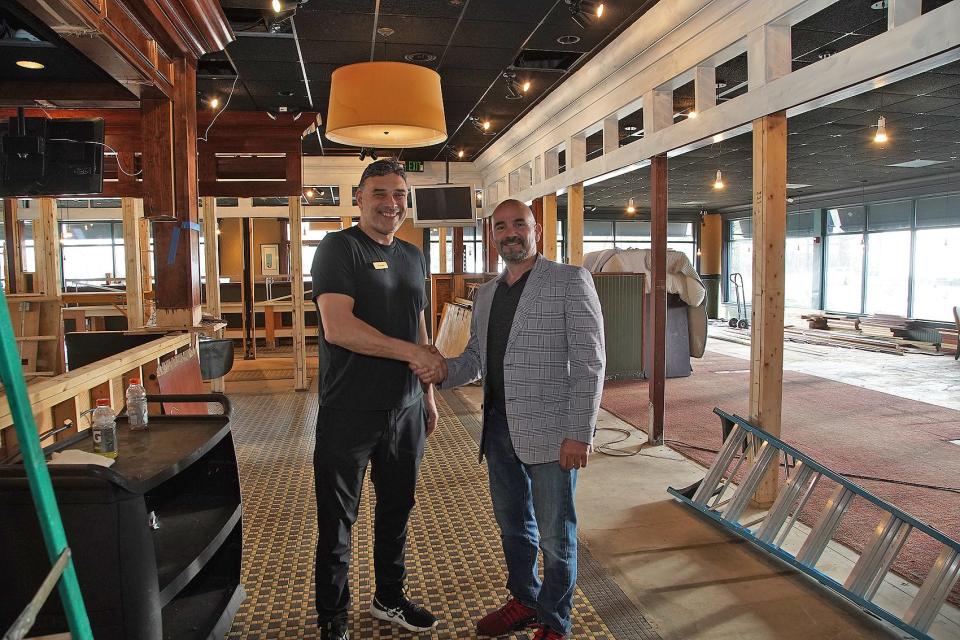 Long time friends Frank Brack, left, and Chris Mather, seen here on Monday, April 19, 2021, are co-owners of Brack’s Grille and Tap, now open at 2097 Bay St. in Taunton .
